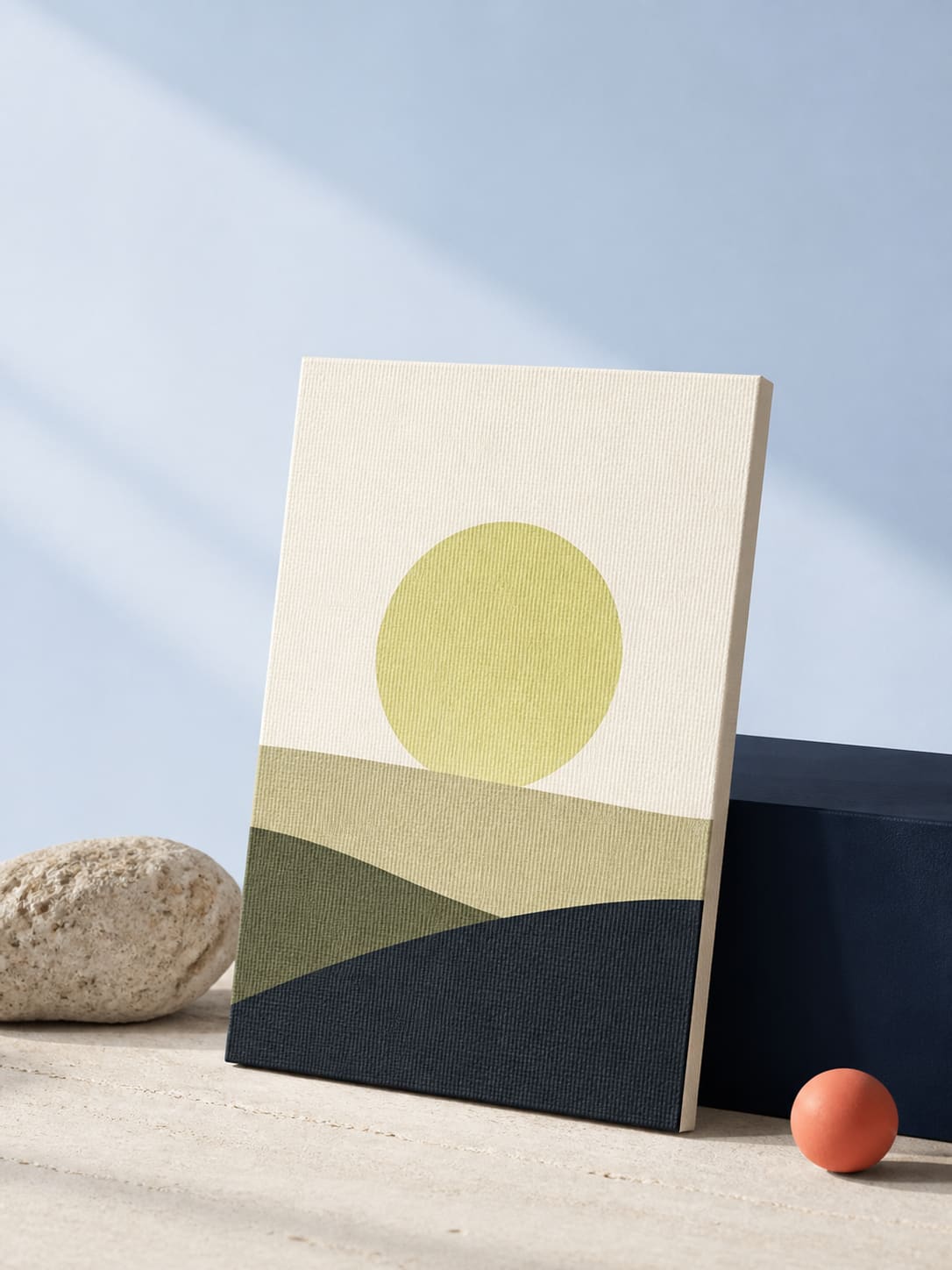 A chartreuse circle resting against a textured cream art object